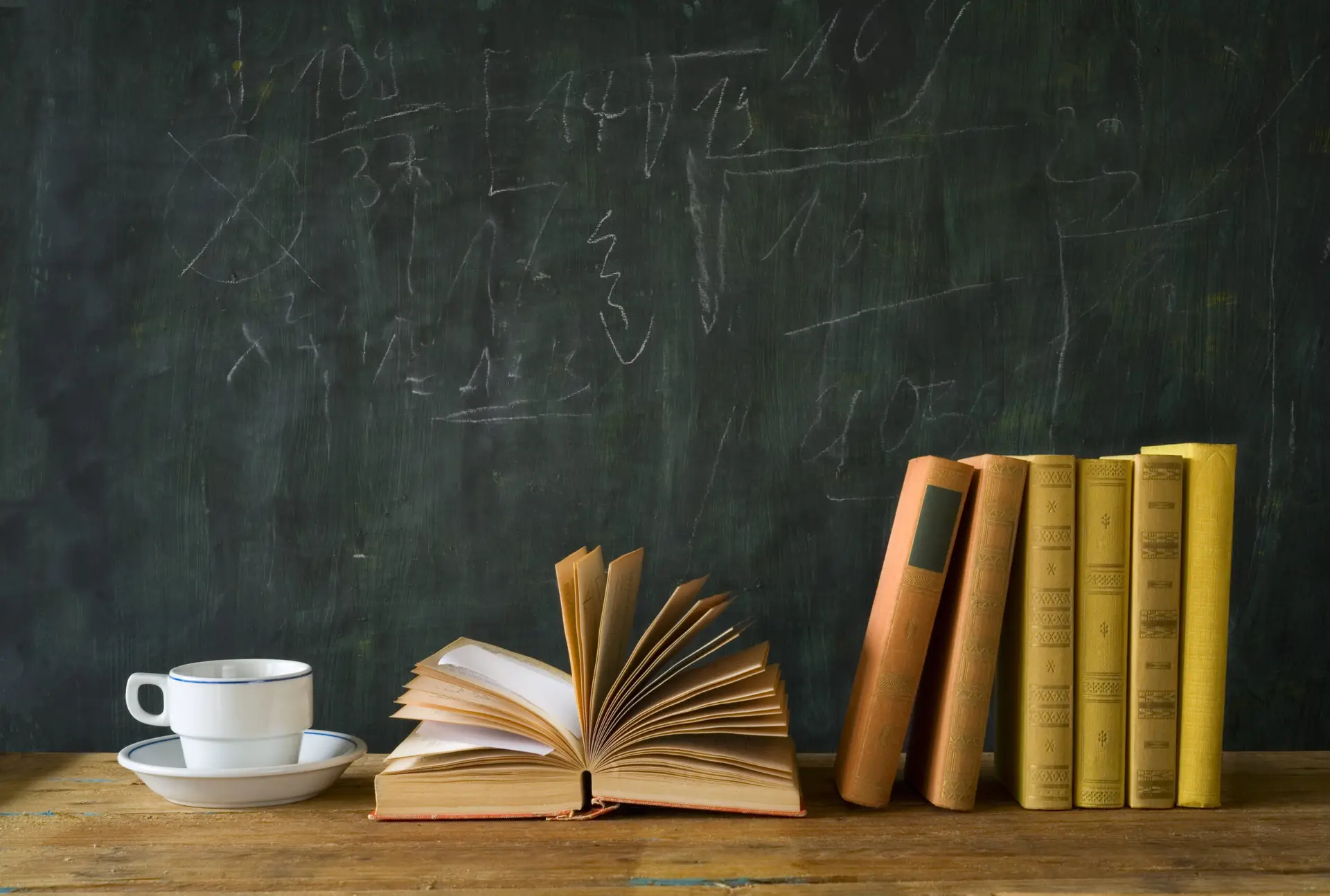 Books and a blackboard, symbolising further learning